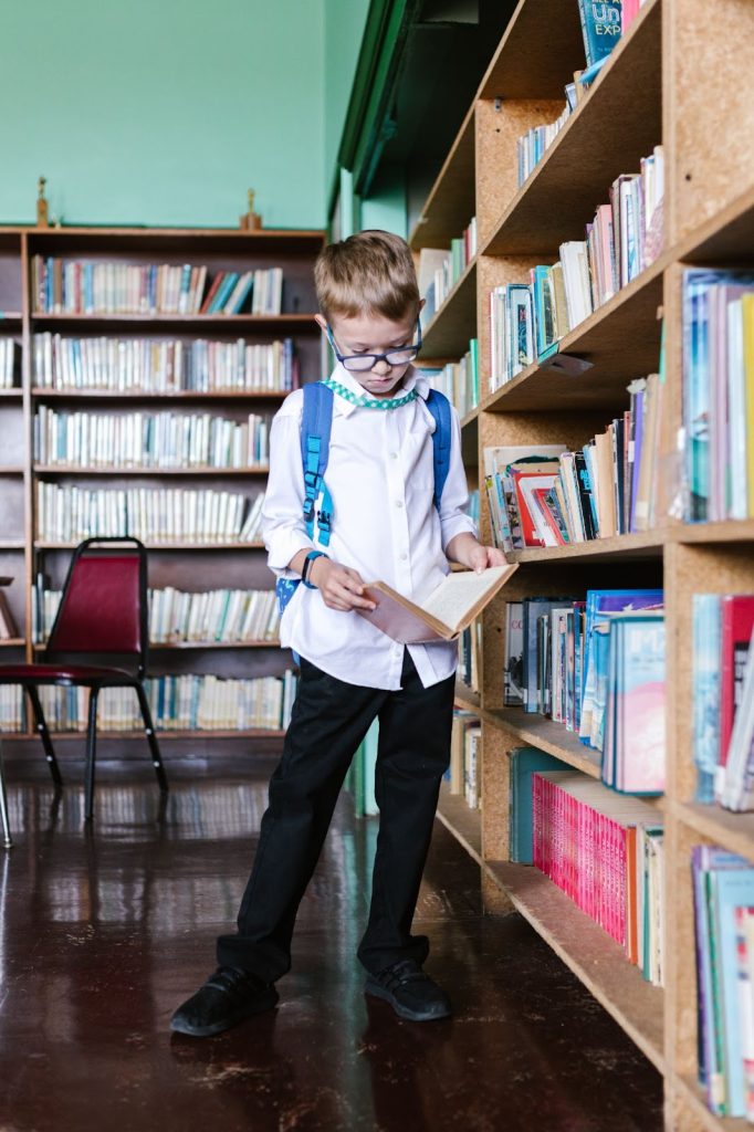 a boy reading and gaining fundamental knowledge at library