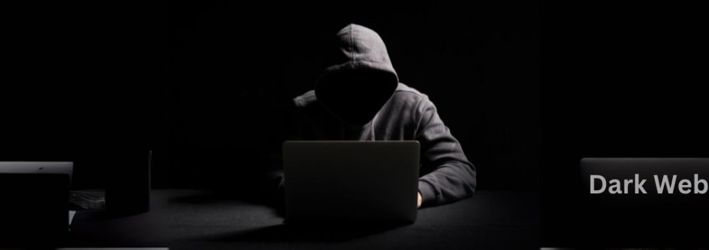 A hacker using Dark Web in his laptop at dark 
